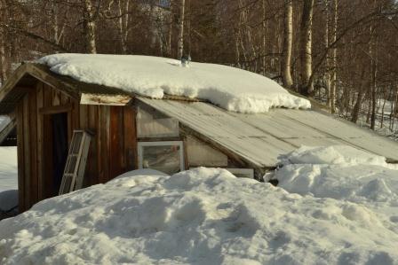 Greenhouse shedding snow